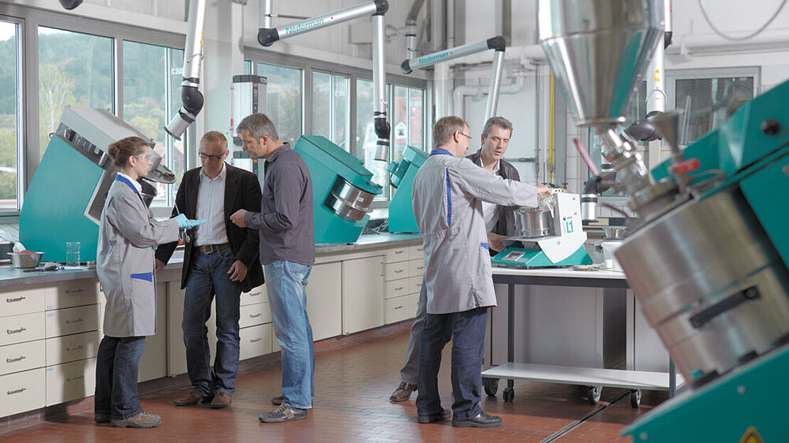 An engineer reading sensor traces inside the Eirich Technikum